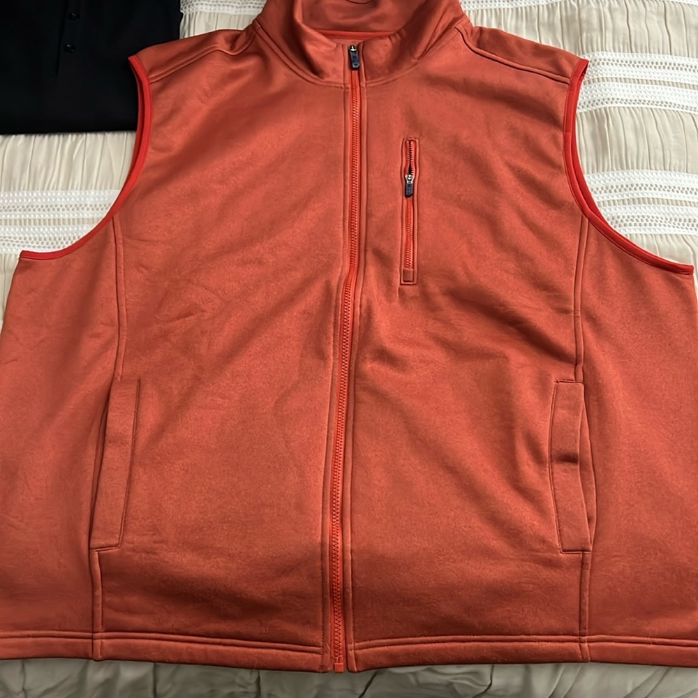 Gently used Izod orange vest in 2xlt